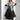 Avant-garde black plaid tulle midi dress featuring an edgy fashion design, showcasing a model wearing the dress with emphasis on the shoulder, sleeve, waist, and thigh areas. The dress is a one-piece garment, styled as a day dress, with a knee-length hem.