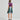 Bavarian Oktoberfest women's green and purple dirndl dress with puffed sleeves and fitted waist, showcasing traditional one-piece garment design.