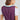 Bavarian Oktoberfest Women's Green & Purple Dirndl Dress featuring a white blouse with puffy sleeves, purple bodice with embroidered detailing, and a green skirt with a traditional apron.