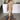 Beige knit oversized cardigan on a woman standing, showcasing its long sleeves and relaxed fit, ideal for fall fashion.
