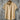 Beige men's short sleeve pleated shirt with a collar, featuring a relaxed fit suitable for summer wear.