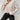 Women's beige oversized collar chunky knit sweater with long sleeves and a loose fit, perfect for casual winter wear.