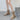 Beige suede women's winter boots featuring a zipper on the side, fluffy lining for warmth, and a non-slip sole, showcasing fashionable design suitable for winter wear.