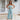 Beige tie-waist sleeveless jumpsuit with a casual yet elegant design, featuring a fitted waist and wide shoulder straps for a chic summer look.