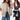 Beige women's satin bomber jacket, lightweight and casual chic, worn by a woman paired with black jeans.
