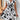 Black and white sleeveless floral skater dress with an A-line silhouette, featuring a summer-ready design perfect for casual outings.