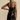 Black floral sheer one-shoulder evening dress showcasing a sheath silhouette with a fitted waist, featuring a single sleeve and elegant design.