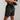 Black men's athletic gym shorts, lightweight, quick-dry, moisture-wicking, highlighting muscle definition and comfort fit.
