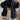Black oversized quilted jacket for women, showcasing lightweight design and urban style. The puffer jacket features a quilted pattern, long sleeves, and a high collar, emphasizing the shoulders and neck area.