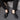 Black textured leather slip-on loafers with a zipper for men, displayed on a solid background.