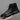 Black high-top sneakers featuring a sleek urban design, suitable for streetwear and outdoor activities.