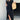 A women's black v-neck maxi dress with an open back design, featuring a sleek sheath silhouette and short sleeves, suitable for summer streetwear.