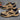 Black waterproof hiking shoes designed for outdoor activities, featuring a durable and non-slip sole ideal for trail walking. The footwear combines elements of sneakers and cross-training shoes, with a sleek design suitable for both hiking and sportswear.