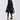 A fashionable black wool coat and oversized cardigan designed for women's winter wear, featuring a knee-length cut, structured collar, and tailored sleeves. The coat embodies a trendy blend of a trench coat and blazer style, modeled by a fashion model.