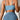 Blue ribbed bikini top with a twisted front design and adjustable straps, modeled on a person wearing matching blue shorts, showcasing the summer swimwear's fit around the shoulders, neck, and stomach.