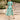 Blue tropical chiffon midi V-neck beach dress for women with a vibrant plant-inspired design, featuring short sleeves and a flowing silhouette, ideal for summer outings.