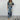 A blue tropical leaf print maxi dress with an elegant V-neck design, featuring short sleeves and a fitted waist, perfect for summer fashion.