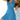 Woman wearing a blue and white geometric V-neck sleeveless A-line summer dress, smiling and posing with hands and arms visible.