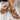 Bohemian Ethnic Floral Beaded Women's Sandals on a foot, featuring intricate handmade designs with stylish floral beads, photographed on a wooden surface.