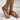 Bohemian Ethnic Floral Beaded Women's Sandals on a woman's foot, showcasing intricate handmade floral beadwork with a stylish pattern. The sandals feature vibrant electric blue and peach accents, reflecting a fashionable and ethnic design.