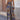 Bohemian ethnic print wide-leg summer jumpsuit in vibrant electric blue, featuring a one-piece design with an elegant neckline and sleeves, styled for a fashionable and relaxed summer look.