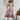 Bohemian floral summer dress in white and red, featuring a mid-length wrap design with short sleeves, displayed on a standing mannequin.