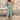 Bohemian floral wide-leg jumpsuit for women, featuring a purple and azure floral pattern, with short sleeves and a comfortable, loose fit ideal for summer beach outings.