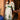 Bohemian green embroidered V-neck maxi dress with puff sleeves and a belted waist, displayed elegantly on a mannequin.