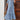 Blue boho maxi dress with a V-neck, featuring an ethnic pattern design, suitable for summer beachwear. The dress includes sleeves and a defined waist, embodying a casual yet stylish look.