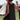 Boho-Chic Crochet Back Sundress featuring a lightweight, airy design, perfect for summer festivals. The image shows a woman wearing the dress paired with a sun hat, standing outdoors on grass with a clear sky backdrop, capturing a relaxed, bohemian vibe.