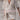 Boho-Chic V-Neck Mini Dress worn by a woman with sunglasses, featuring a loose-fitting design with short sleeves, cinched waist, and flowing fabric perfect for summer or as a beach cover-up.