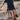 Boho-Chic V-Neck Mini Dress worn by a model with flowing hair, showcasing a stylish look for summer or beach settings.