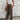 Brown boho ethnic pattern women's wide-leg casual summer pants, showcasing intricate fashion design details, focused on the waist and thigh areas.