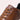 Brown leather men's low-top sneakers featuring a stylish, versatile design with a contrasting white sole, suitable for various casual and outdoor occasions.