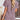Brown pleated V-neck women's casual summer top made of soft fabric, modeled by a woman.