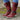 Burgundy women's combat boots with chunky sole and quilted panels, showcased on a human leg.