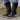 Burgundy women's combat boots with chunky soles and quilted panels, displayed on a grassy surface.