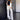 Women's chic beige tracksuit featuring a stylish design with a focus on comfort and elegance, highlighting elements such as the neck, sleeves, waist, and thigh areas.