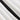 A pair of chic black and white striped bell-bottom yoga pants for women displayed flat on a surface, showcasing the bold stripe pattern and flared leg design.