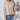 Chunky knit textured beige sweater for women, featuring long sleeves and a high neckline, showcasing a cozy autumn fashion look.