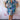 Colorful wave pattern knee-length summer dress in multicolor with a V-neck design, worn by a person.