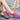 Colorful women's running shoes featuring a lightweight and breathable design. The sneakers are predominantly white with accents of green and black, showcasing a fashionable and sporty style.