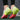 Colorful women's running shoes featuring a lightweight and breathable design, showcasing a vibrant magenta and electric blue color scheme. The sneakers are styled for athletic activities, suitable for outdoor use, and are worn on a human leg amidst a natural setting.