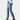 A pair of women's light wash denim distressed ripped skinny jeans, showcasing knee and thigh rips, classic waist design, and worn as casual outerwear.