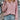 Dusty rose ribbed quarter-zip pullover for women, showcasing a stylish autumn fashion look, paired with jeans.