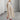 Eco-friendly oatmeal linen maxi dress featuring a minimalist loose fit design with long sleeves, tailored for casual day wear.