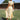 Elegant black midi dress with a back cutout, showcasing evening wear style; the dress features short sleeves and a fitted waist, worn by a person standing on grass.