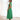 Elegant black midi dress featuring a back cutout, designed for evening wear, showcasing its form-fitting silhouette with shoulder, waist, and thigh details.