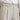 Elegant beige high-waisted pleated trousers worn with a white dress shirt, showcasing a sophisticated women's office wear look.