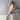 Elegant beige turtleneck midi dress featuring long sleeves, a fitted waist, and a chic design suitable for fall office wear. The dress extends below the knee, highlighting the elegant silhouette.
